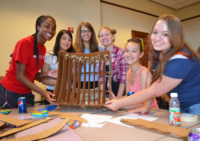 Group of campers from a joint session of GLAM and G-BAM show off the solar collector they were working on.