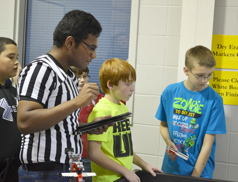 iRobotics member judges an event during the practice tournament the organization held in November.
