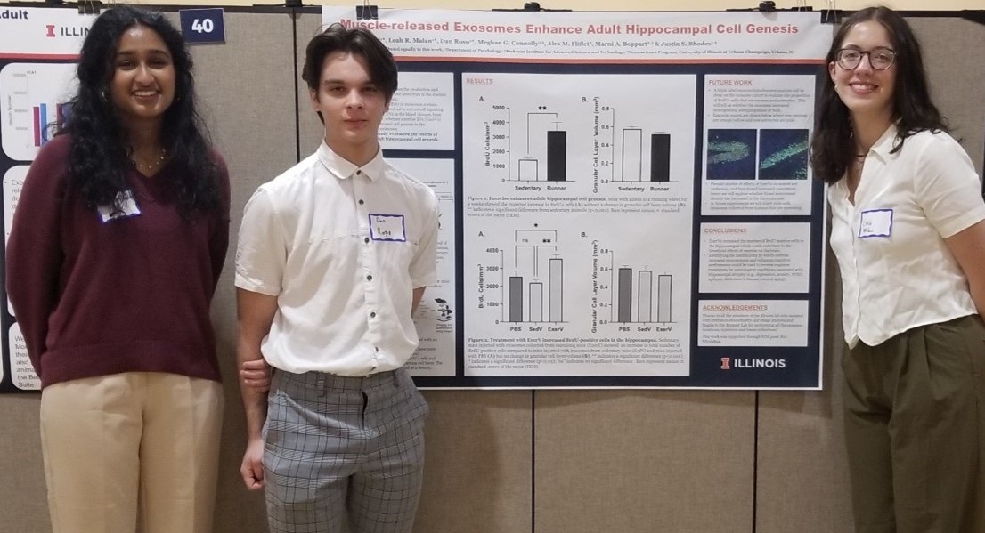 University of Illinois students Prithika Ravi and Leah Malan and University High School Student Dan Rosu (center), flank their visual presentation at the 2023 Undergraduate Research Symposium at the U of I campus in May(2023).